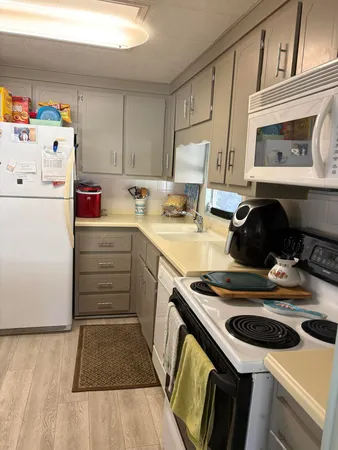 a kitchen with a stove and a refrigerator