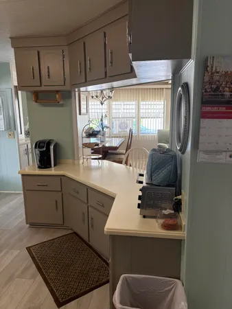 a kitchen with sink cabinets and window