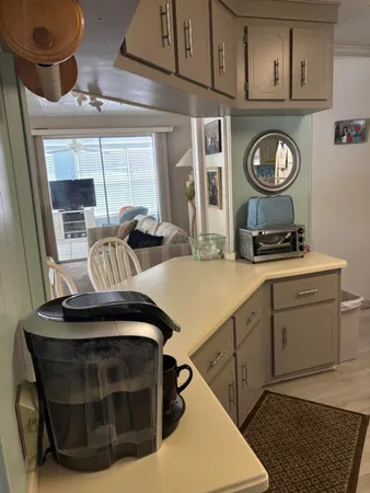 a view of a kitchen with appliances and a window