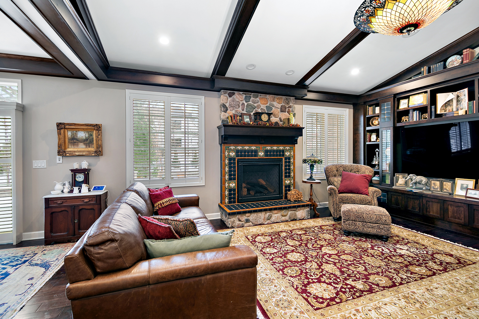 16665 Merc Lane Lockport, IL 60441 - Photo 12 of 54 a living room with furniture a flat screen tv and a fireplace