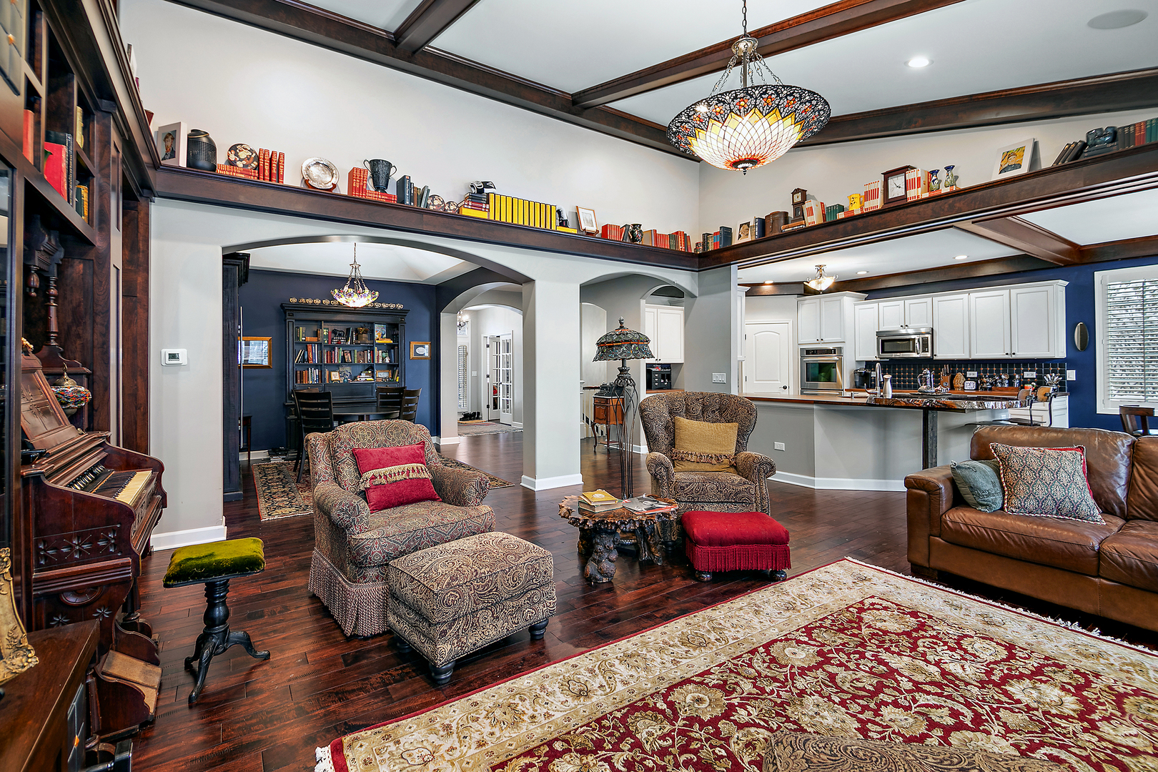 16665 Merc Lane Lockport, IL 60441 - Photo 16 of 54 a living room with furniture a rug and a chandelier
