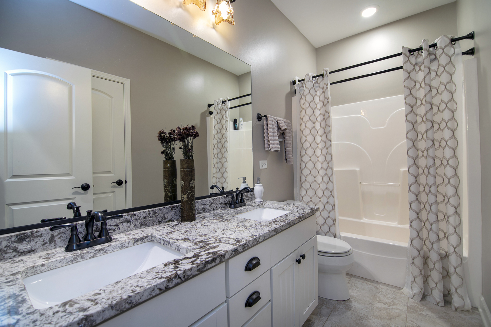 16665 Merc Lane Lockport, IL 60441 - Photo 31 of 54 a bathroom with a granite countertop sink toilet and shower