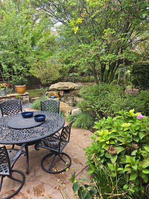 16665 Merc Lane Lockport, IL 60441 - Photo 50 of 54 a view of a backyard with table and chairs potted plants and swimming pool