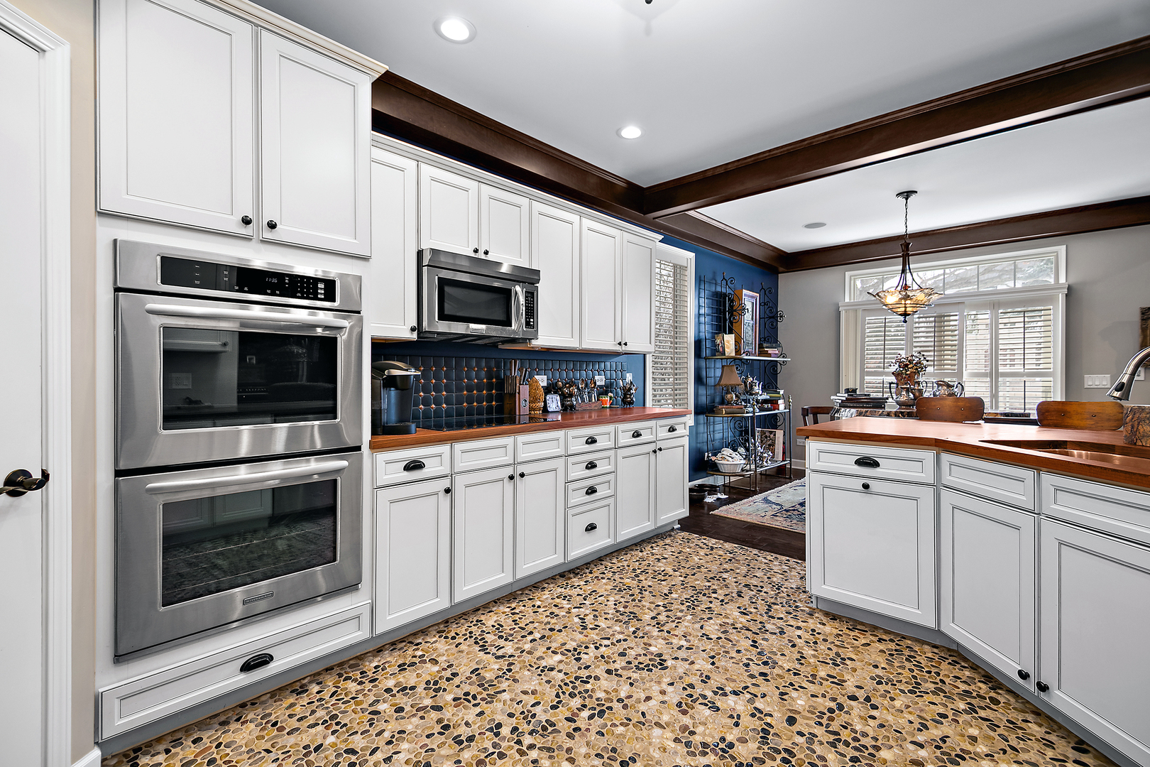 16665 Merc Lane Lockport, IL 60441 - Photo 8 of 54 a kitchen with stainless steel appliances kitchen island granite countertop a stove sink and microwave