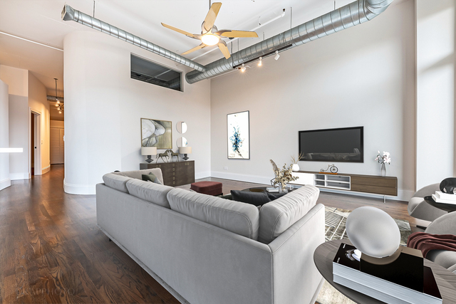 1000 West Adams Street, Unit 413 Chicago, IL 60607 - Photo 13 of 29 a living room with furniture and a flat screen tv