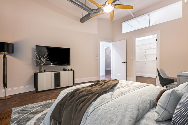 1000 West Adams Street, Unit 413 Chicago, IL 60607 - Photo 16 of 29 a bedroom with a bed and a flat screen tv