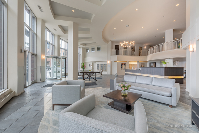 1000 West Adams Street, Unit 413 Chicago, IL 60607 - Photo 2 of 29 a living room with furniture and a large window