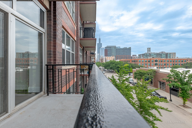 1000 West Adams Street, Unit 413 Chicago, IL 60607 - Photo 23 of 29 a city view with tall buildings and street