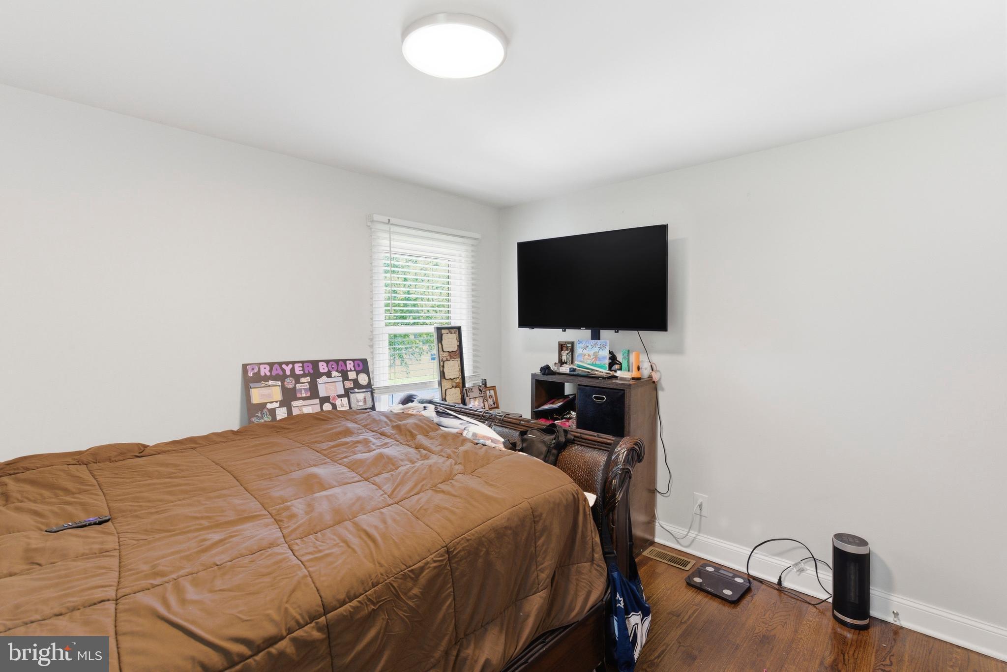 912 Shelley Road Towson, MD 21286 - Photo 18 of 27 a bedroom with a bed and a flat screen tv