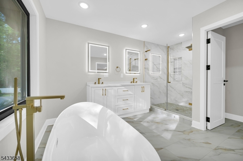 2 Orchard Road Florham Park, NJ 07932 - Photo 21 of 23 a spacious bathroom with a double vanity sink a mirror and a shower
