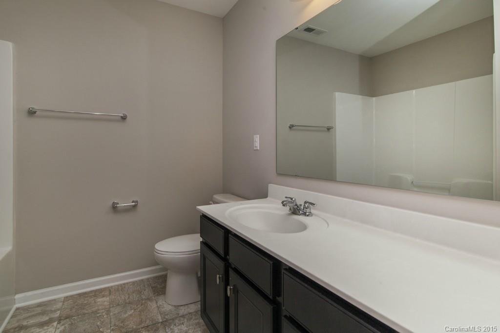 79475 Ridgehaven Road, Unit 43 Lancaster, SC 29720 - Photo 19 of 21 a bathroom with a sink a toilet and shower