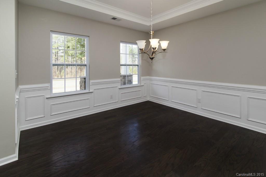 79475 Ridgehaven Road, Unit 43 Lancaster, SC 29720 - Photo 10 of 21 a view of empty room with wooden floor and fan