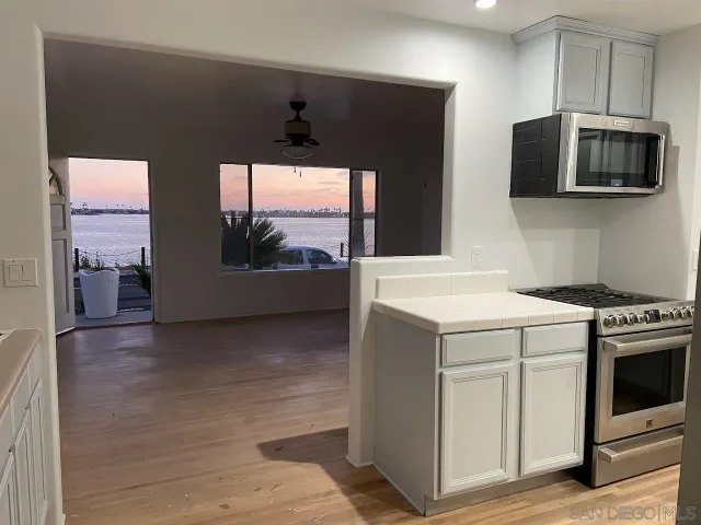 a kitchen with a stove and a microwave