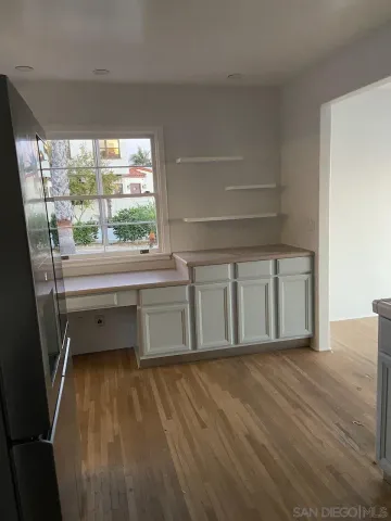 a view of a hardwood & utility room