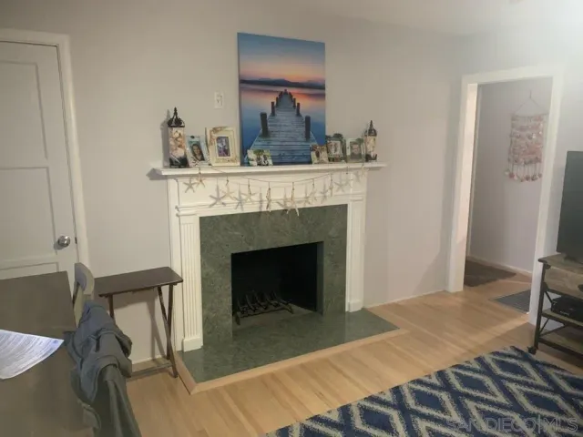 a bedroom with a bed and a fireplace