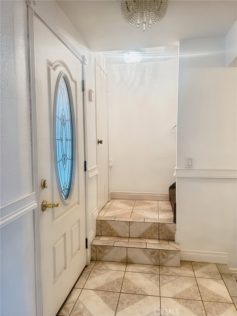 3600 Mountain, Unit 12F San Bernardino, CA 92404 - Photo 8 of 10 a view of front door with a mirror