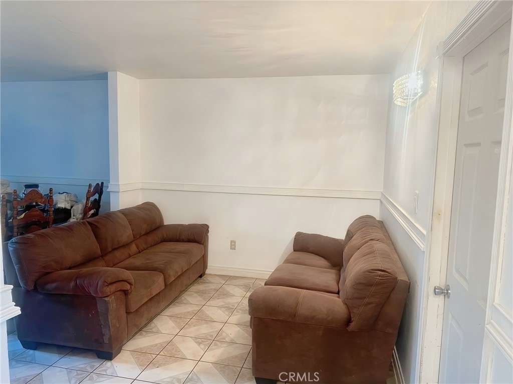 3600 Mountain, Unit 12F San Bernardino, CA 92404 - Photo 9 of 10 a living room with furniture and a couch