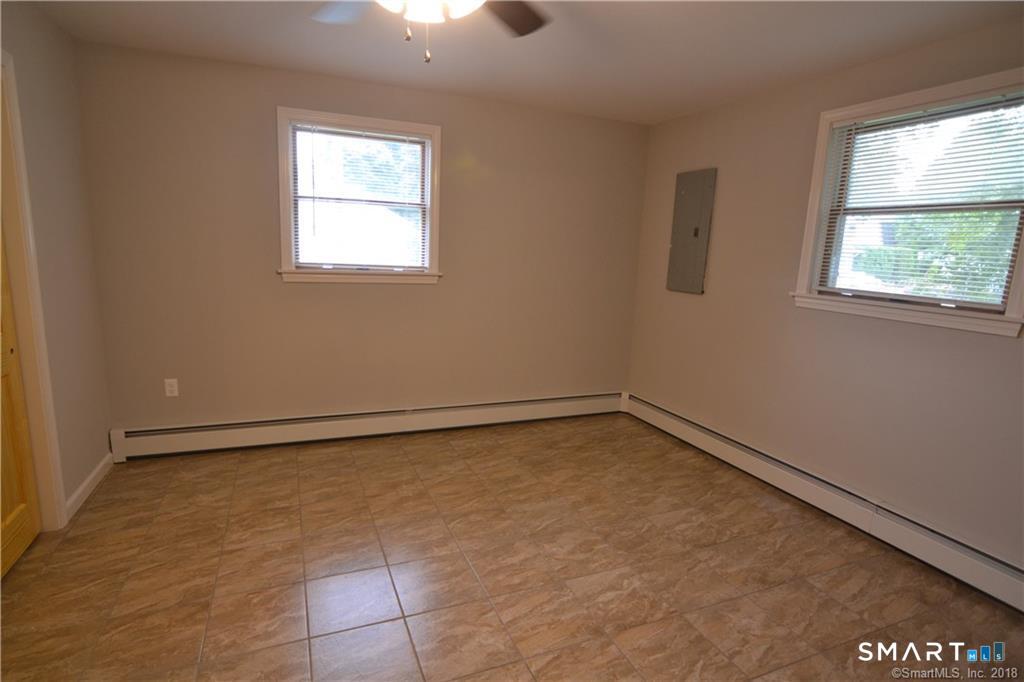60 Central Boulevard Groton, CT 06340 - Photo 13 of 18 an empty room with a window