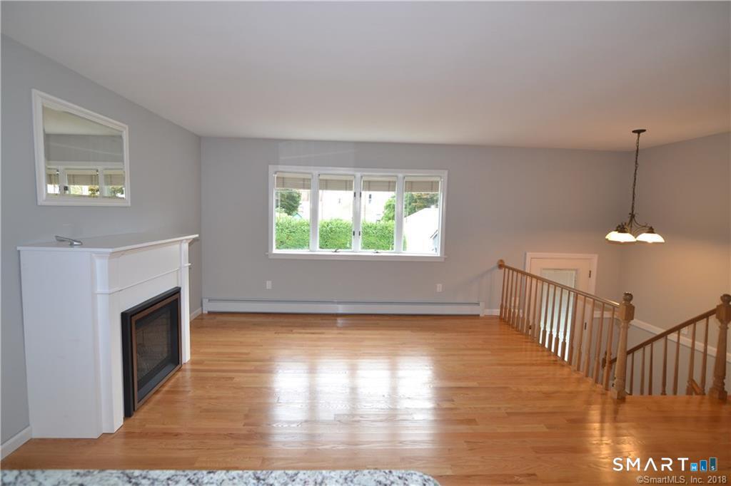 60 Central Boulevard Groton, CT 06340 - Photo 15 of 18 a view of empty room with wooden floor and fan