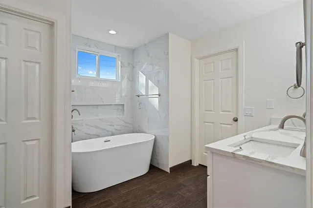 a bathroom with a sink and bathtub