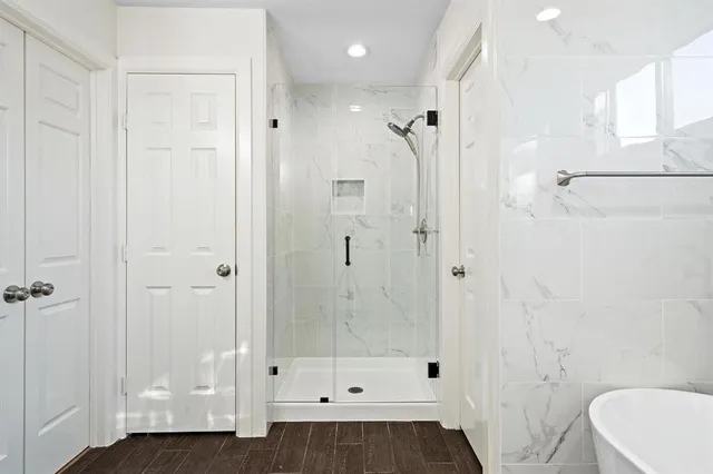 a bathroom with a shower and a toilet
