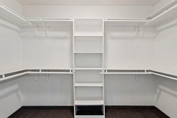a view of an empty walk in closet