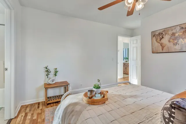 a bedroom with a bed and a table