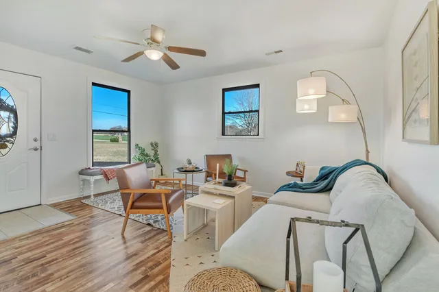 a work room with furniture and windows