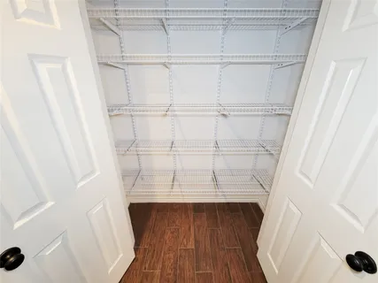 a view of entryway with wooden floor