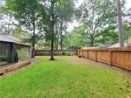 a view of a backyard with green space