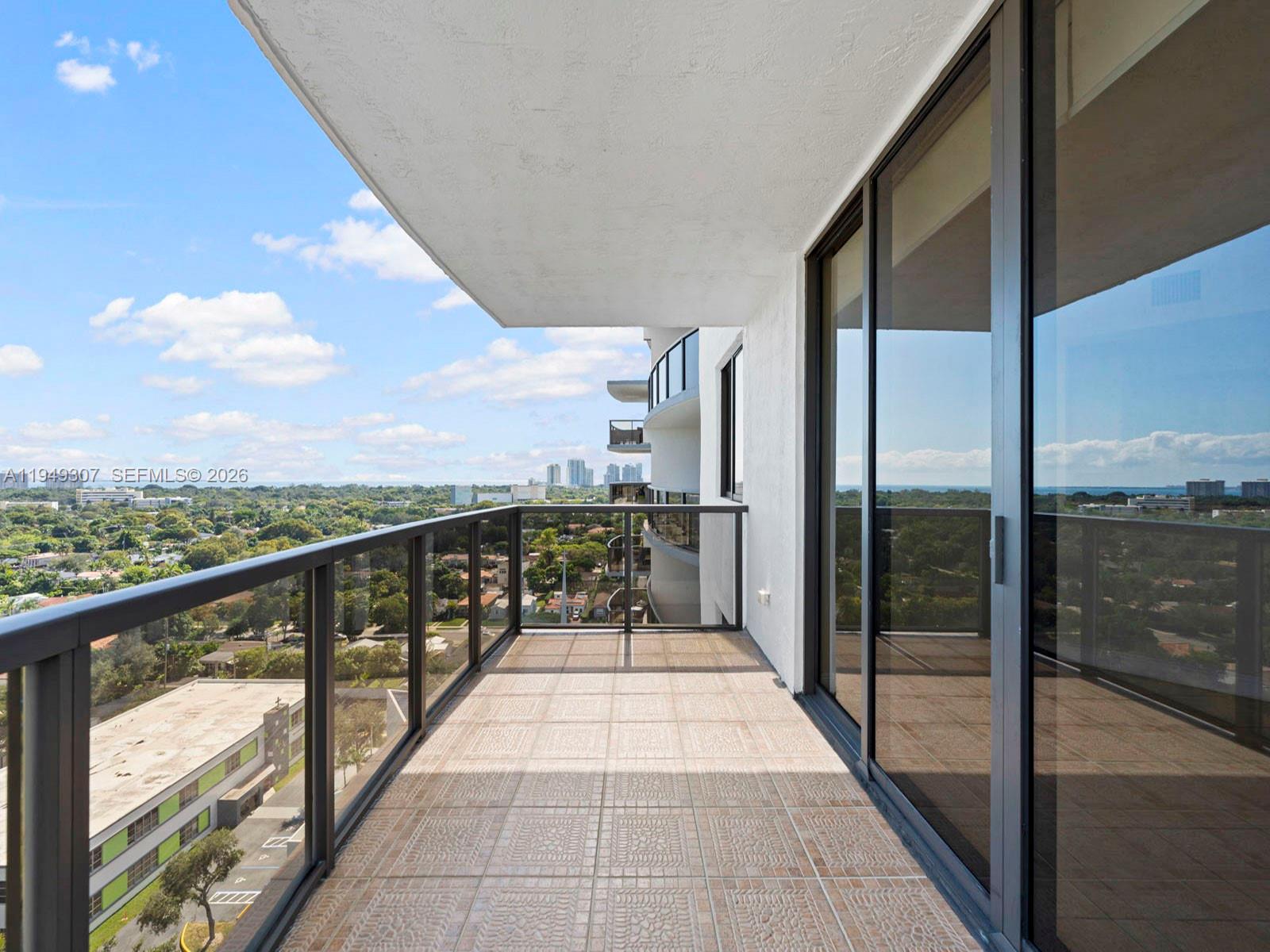 2301 Southwest 27th Avenue, Unit 1403 Miami, FL 33145 - Photo 13 of 53 Balcony off of living/dining room