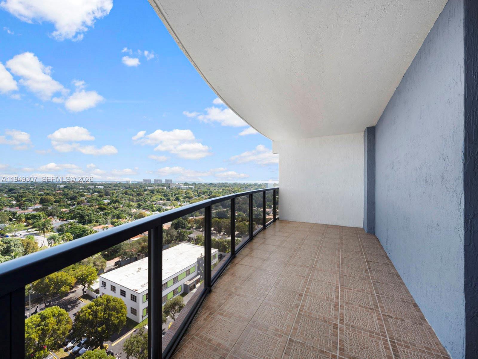 2301 Southwest 27th Avenue, Unit 1403 Miami, FL 33145 - Photo 32 of 53 Covered terrace off of 2nd bedroom