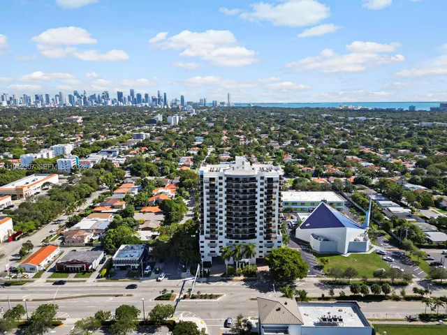 an aerial view of city and lake