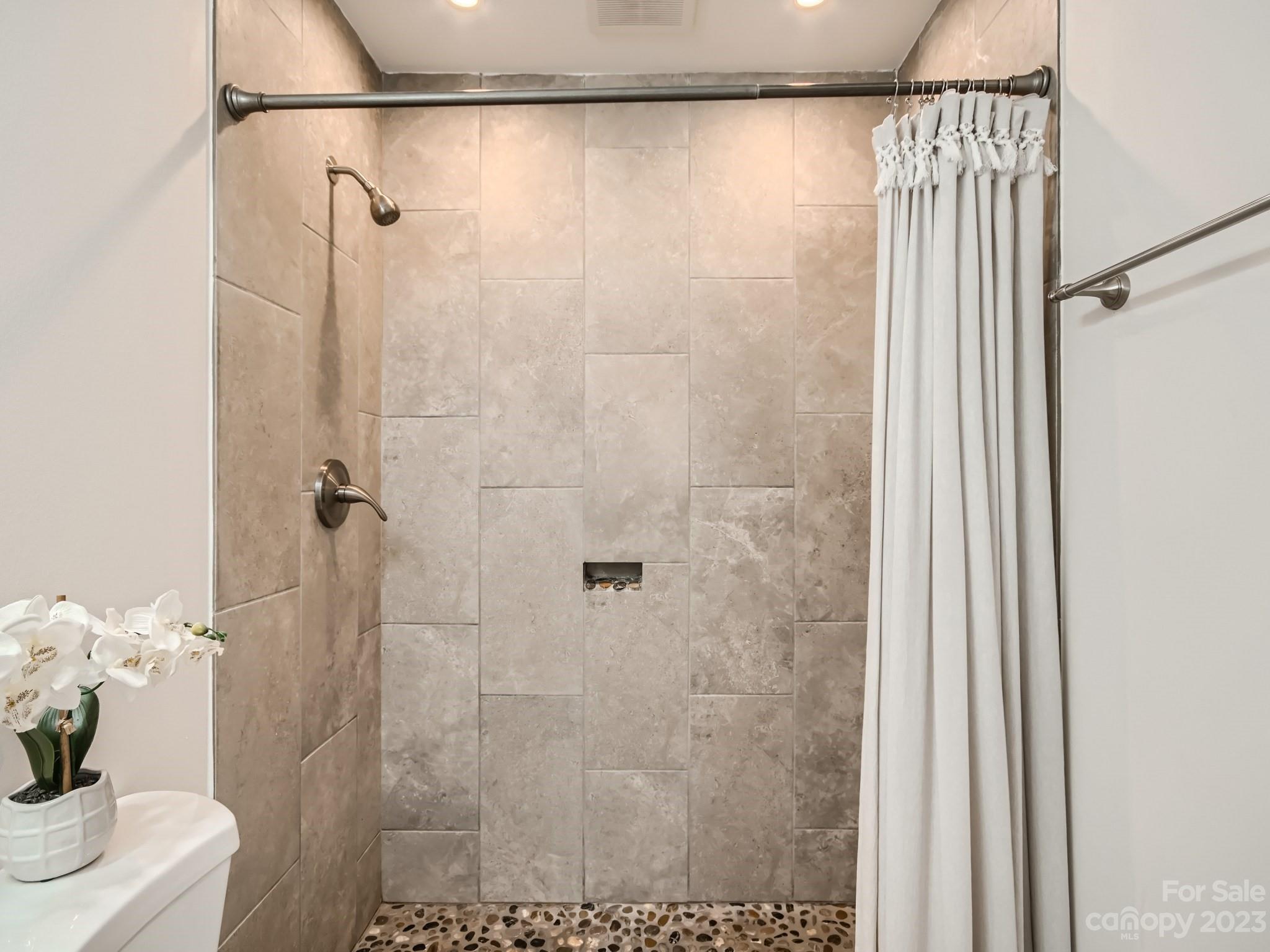6715 Reddman Road Charlotte, NC 28212 - Photo 21 of 28 a bathroom with a shower