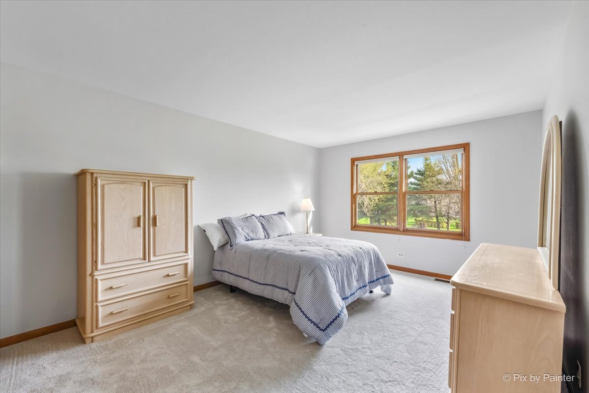 1405 Elk Trail Cary, IL 60013 - Photo 11 of 39 a bed room with a bed and a window
