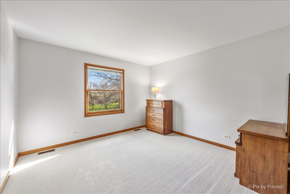 1405 Elk Trail Cary, IL 60013 - Photo 13 of 39 a view of an empty room with a window