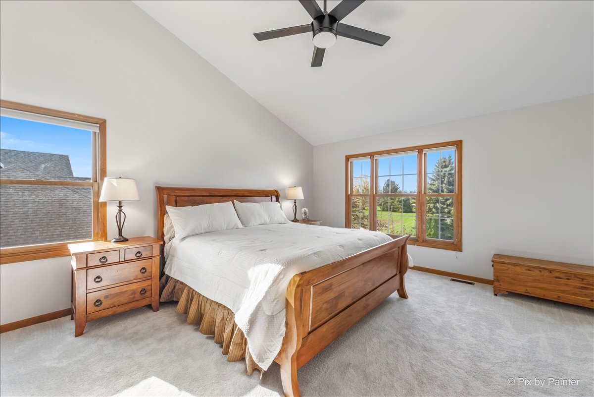 1405 Elk Trail Cary, IL 60013 - Photo 22 of 39 a bed sitting in a bedroom next to a window