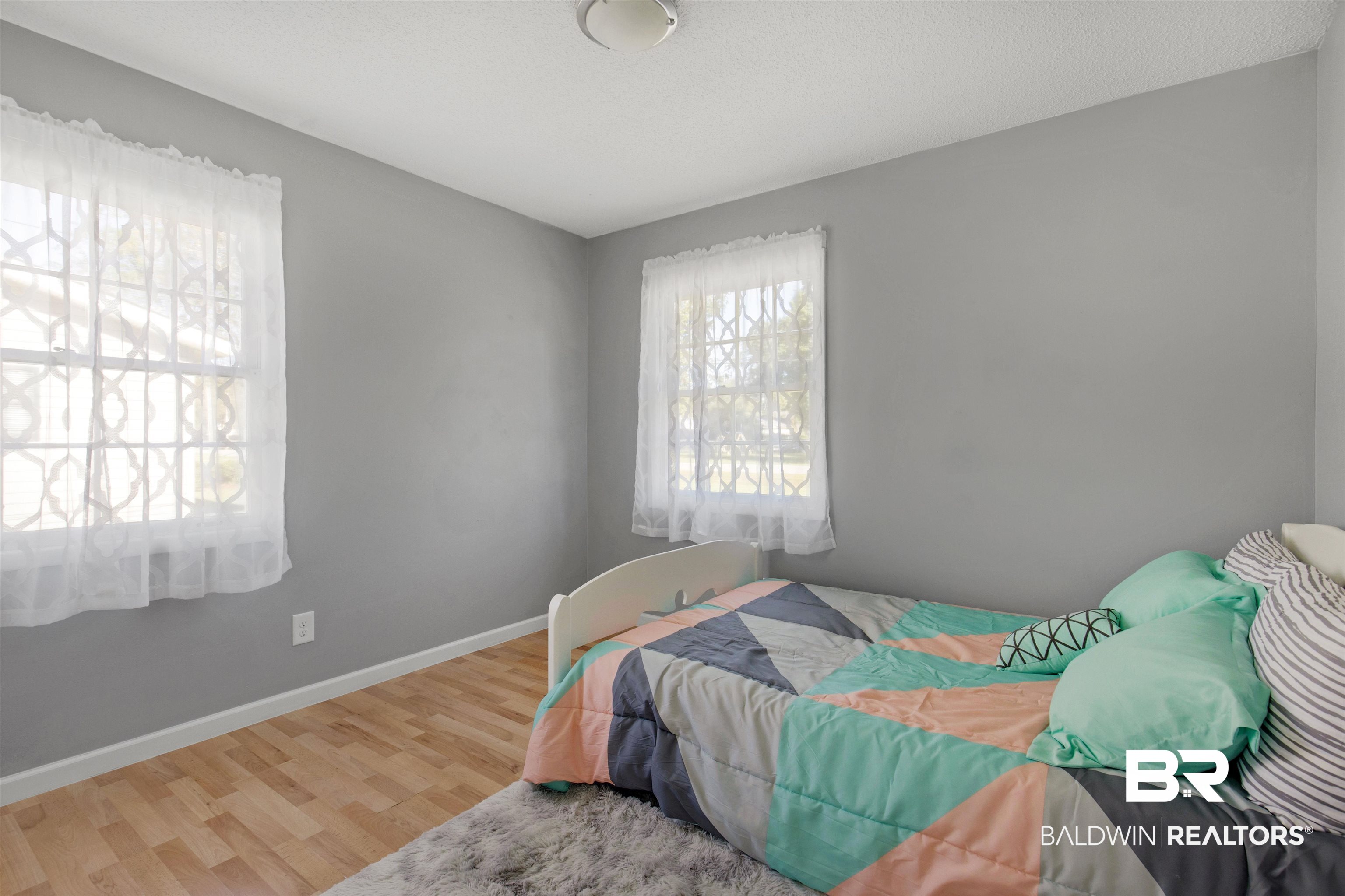 501 West Craig Street Atmore, AL 36502 - Photo 17 of 26 Bedroom with hardwood / wood-style floors