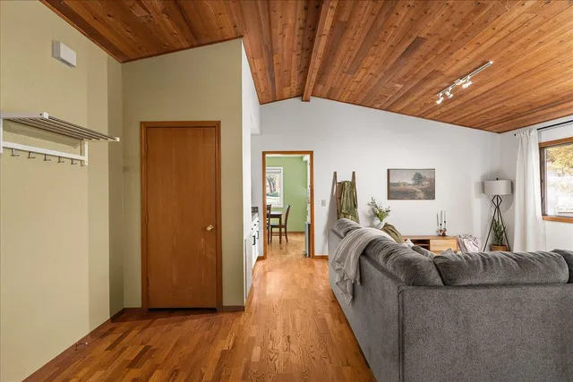 a living room with furniture a couch and chandelier