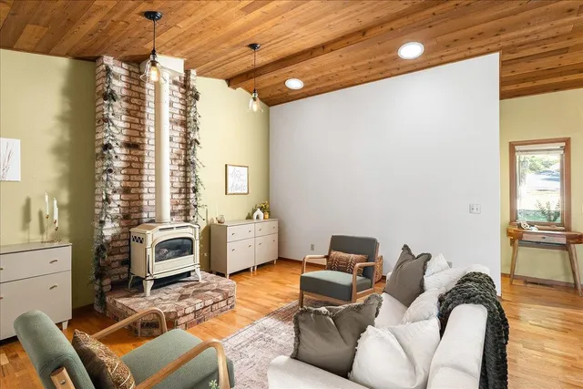 a view of a dining room with furniture and window