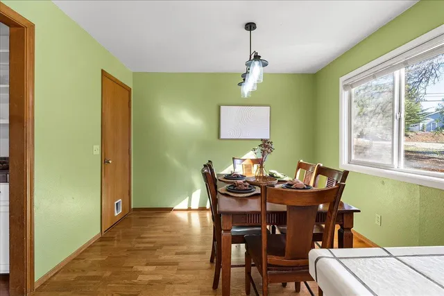 a kitchen with stainless steel appliances a stove a refrigerator and white cabinets