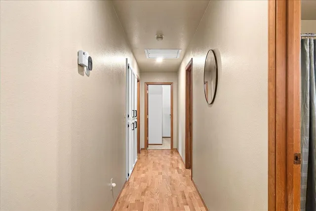 a view of a storage and utility room with washer and dryer