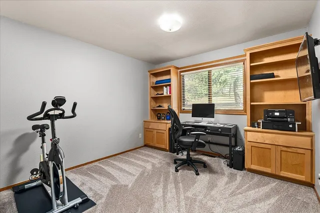 a bedroom with a bed and a lamp