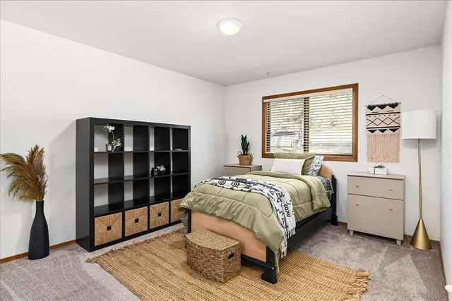 a view of a brick house with a large window