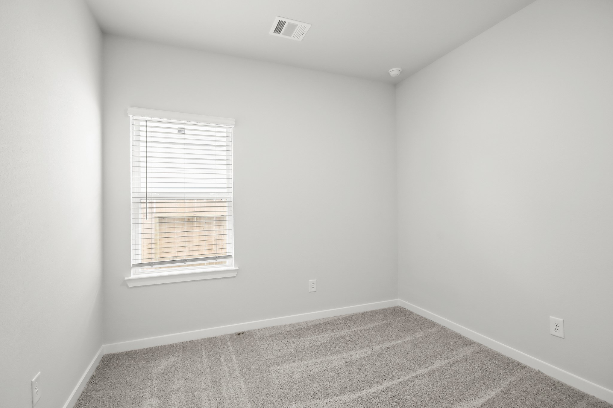 225 Spring Drive Hockley, TX 77447 - Photo 15 of 24 an empty room with a window