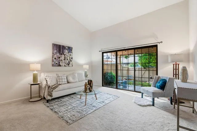 a spacious bedroom with a bed and a large window