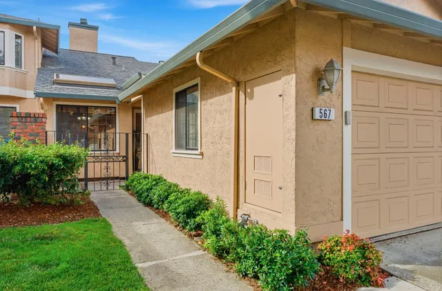 a front view of a house with garden