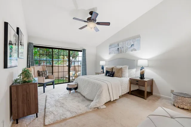 a spacious bathroom with a double vanity sink a mirror and a shower