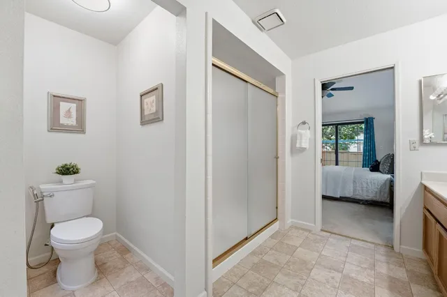 a bedroom with a bed and a chair