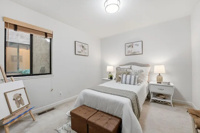 a bathroom with a shower a sink and a toilet